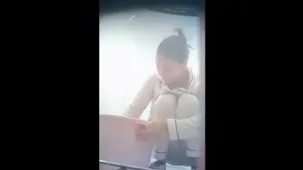 Chinese college girl taking a shower in the drom bathroom.