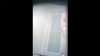Chinese college girl taking a shower in the drom bathroom.